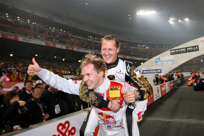 mattias-ekstrom-and-michael-schumacher-celebrate.jpg